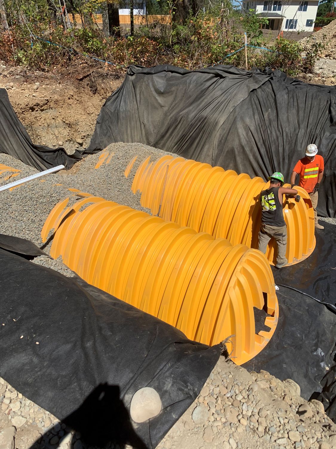 Underground infiltration chambers on geotextile liner