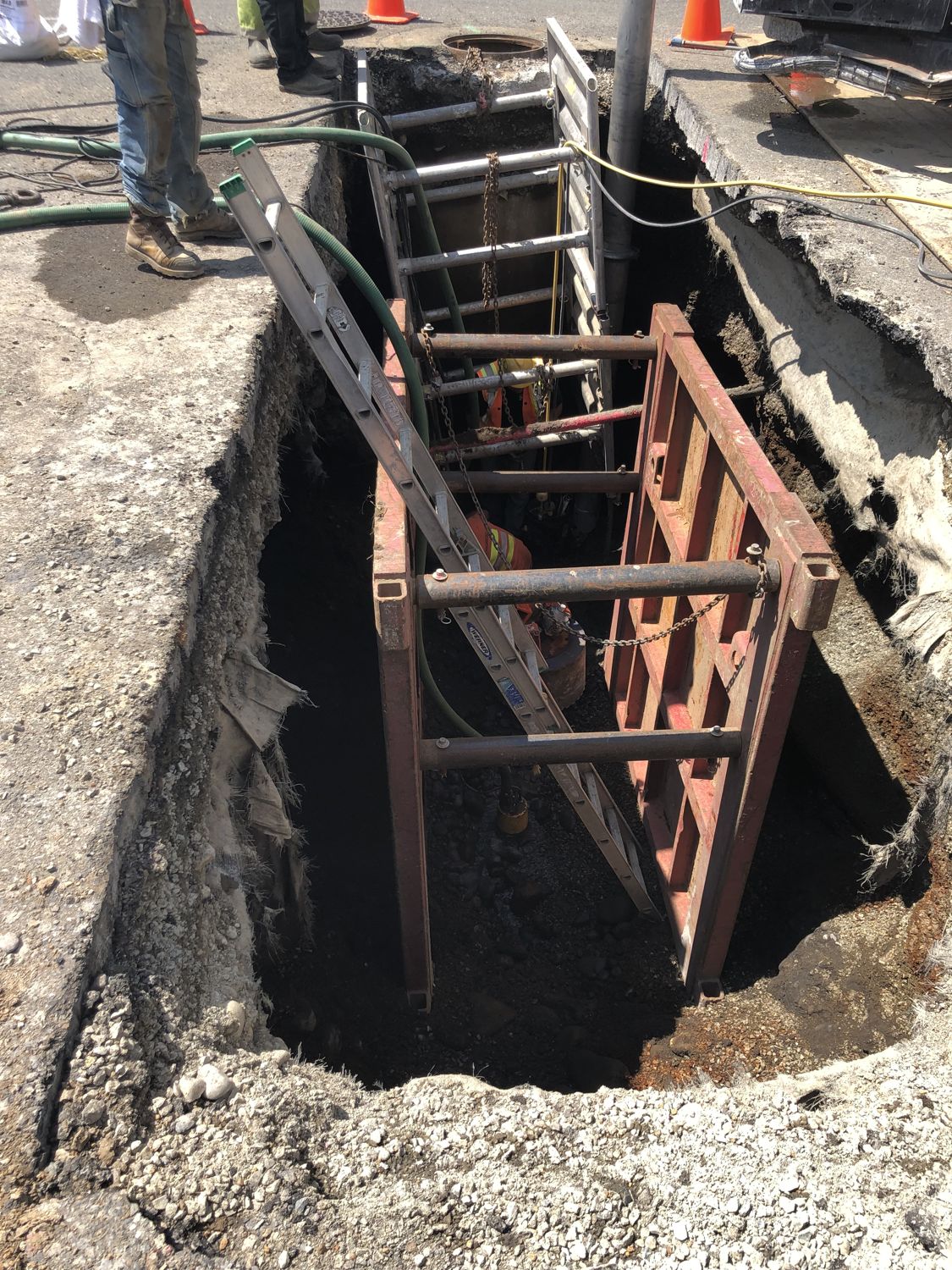 Storm outfall structure and shoring in a deep excavation