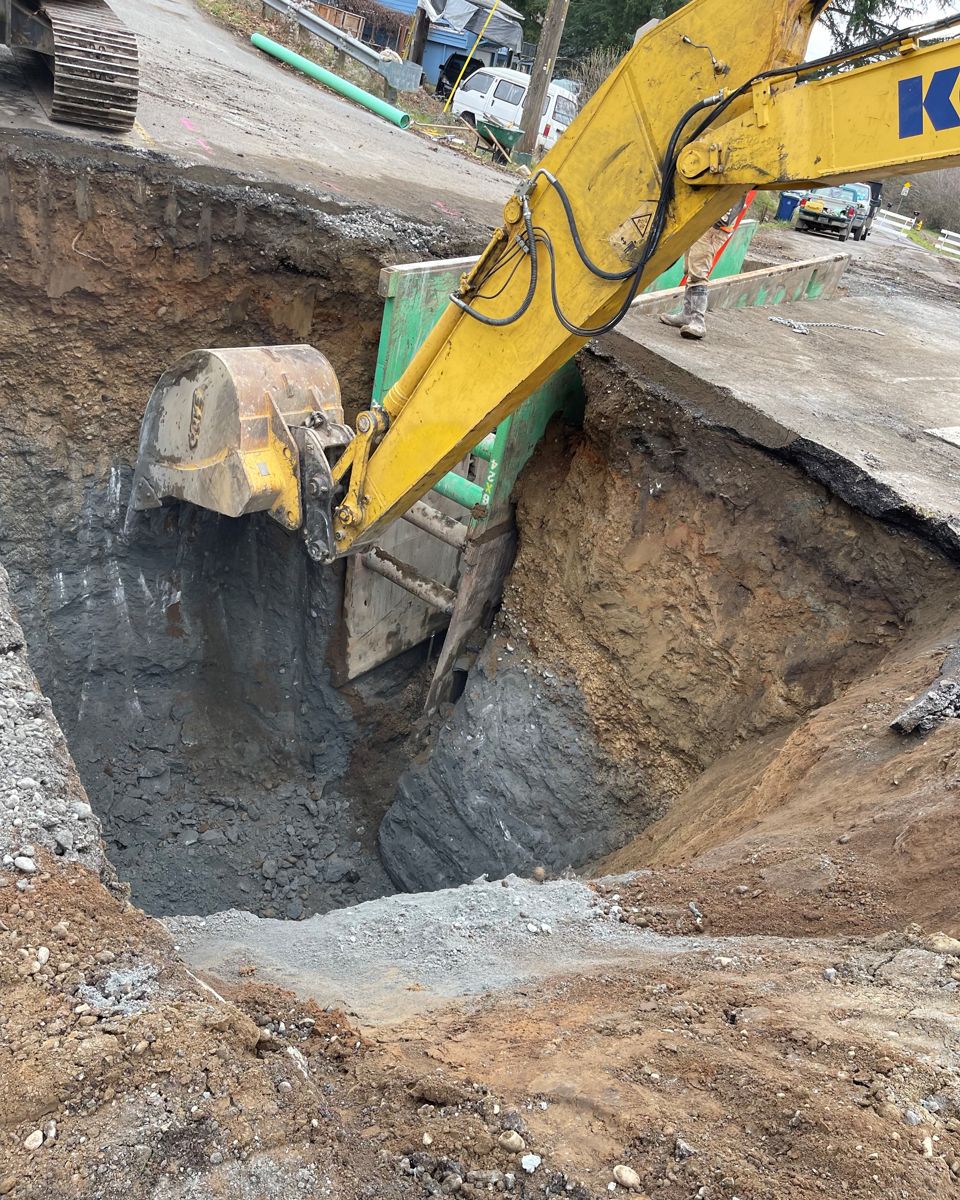 Riverton excavator digging a deep foundation excavation on a Greater Seattle site